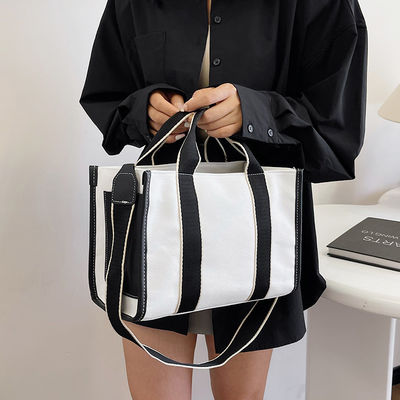Materiais principais PU GHJ-31 Bolsas para mulheres com detecção de movimento e design listrado