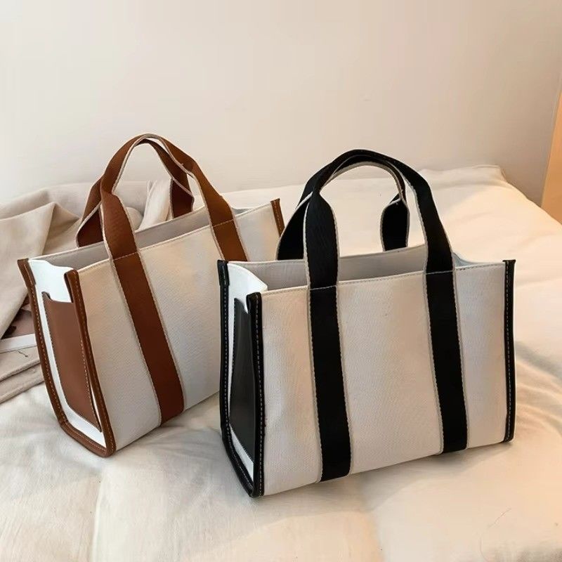 Materiais principais PU GHJ-31 Bolsas para mulheres com detecção de movimento e design listrado
